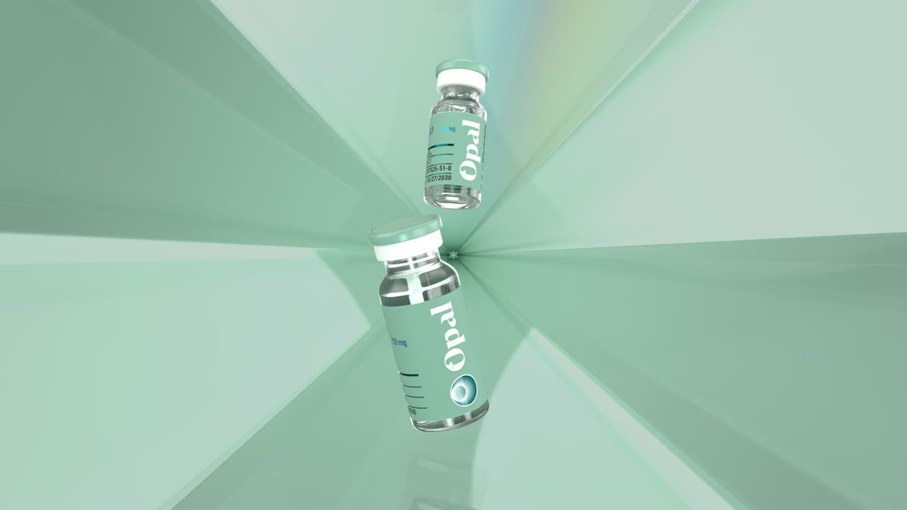 Two Opal Peptides vials in a prismatic glass environment